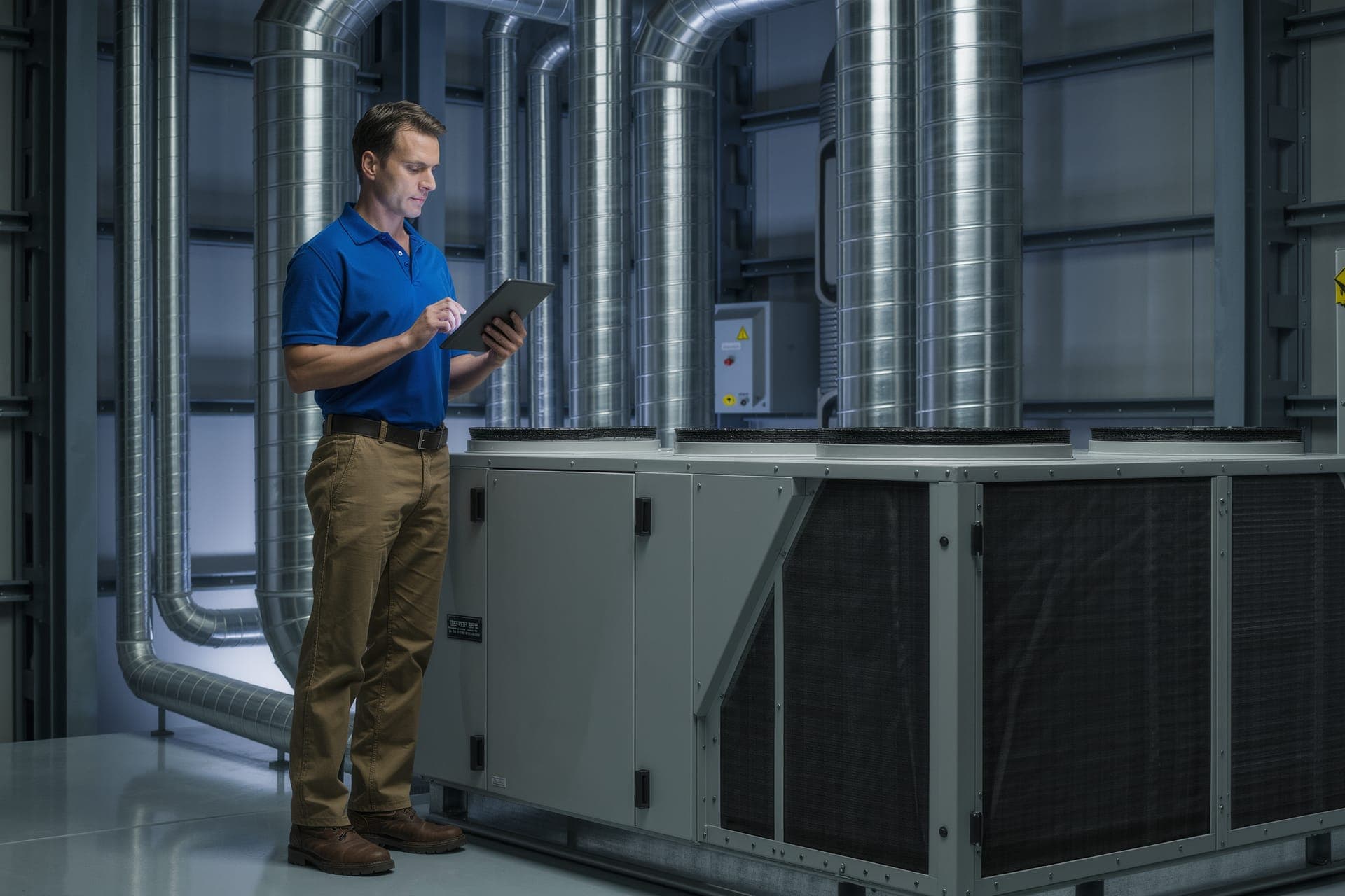 Bleuwave technician documenting a commercial HVAC assessment